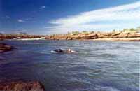 Floating packs above Solea Falls, June 2000