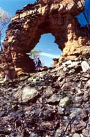 Walking through a rock arch