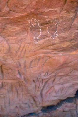 Rock carvings below paintings of fruit bats