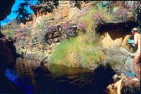 Walking through a rock arch