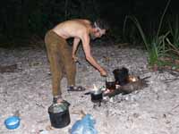 Guide Russell preparing dinner