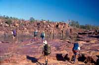 Walking over flat rock near Drysdale River